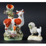 STAFFORDSHIRE COW AND MILKMAID SPILL VASE, with red patches, height 14cm; together with a