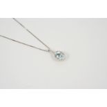 AN AQUAMARINE AND DIAMOND CLUSTER PENDANT the oval-shaped aquamarine is set within a surround of