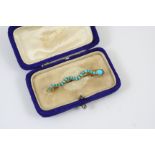 AN EARLY VICTORIAN TURQUOISE AND GOLD SNAKE BROOCH set with turquoise cabochons, with cabochon