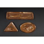 NEWLYN COPPER including a small oval dish and small triangular dish, both with a Fish design and