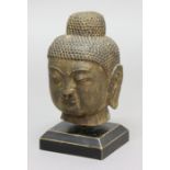 SINO TIBETAN STONE BUDDHA HEAD, with closed eyes and long ears, height excluding stand 25cm