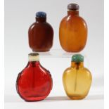 COLLECTION OF FOUR CHINESE GLASS SNUFF BOTTLES, to include three simulating amber and one red glass,