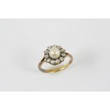 A DIAMOND AND PEARL CLUSTER RING the untested pearl measures approximately 6.5m and is set within