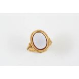 A VICTORIAN AGATE AND GOLD RING the oval-shaped agate is set within a gold mount embossed with