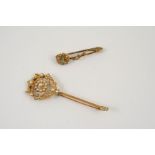 AN EARLY 20TH CENTURY GOLD AND PEARL SET BROOCH the foliate openwork design is set overall with