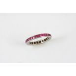 A RUBY FULL CIRCLE ETERNITY RING mounted with calibre-cut rubies in white gold. Size P 1/2