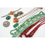 A QUANTITY OF JEWELLERY including a jade bead necklace, an amber and silver bracelet, an amber