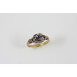 A GEORGIAN SAPPHIRE AND DIAMOND CLUSTER RING the rectangular shaped sapphire is set within a