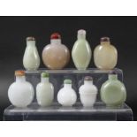 COLLECTION OF NINE CHINESE GLASS SNUFF BOTTLES, simulating jade in shades of russet, celadon and