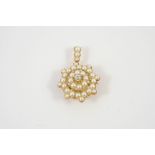 A VICTORIAN DIAMOND AND PEARL BROOCH PENDANT of flowerhead form, centred with an old brilliant-cut