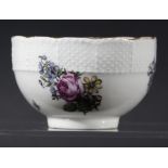 MEISSEN TEA BOWL, probably late 18th century, painted with floral sprigs beneath an ozier border,