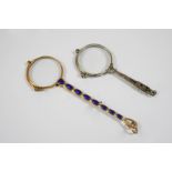 A PAIR OF GOLD AND ENAMEL PINCE-NEZ the handle with blue and white enamel and gold decoration, 14cm.