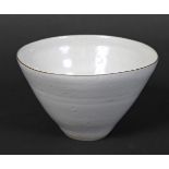LUCIE RIE (1902-1995) a small stoneware bowl with a pale grey glaze and thin manganese rim, the