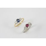 A SAPPHIRE AND DIAMOND THREE STONE RING the oval-shaped sapphire is set with two circular-cut