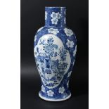 CHINESE BLUE AND WHITE BALUSTER VASE, Kangxi style but later, painted with cartouches of vases, koro