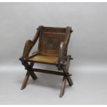 VICTORIAN GOTHIC OAK 'GLASTONBURY' CHAIR with panelled back and seat, and x frame support and