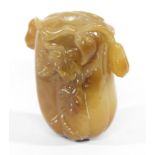 CHINESE AMBER COLOURED JADE SNUFF BOTTLE AND STOPPER, carved as a fruit or gourd with meandering