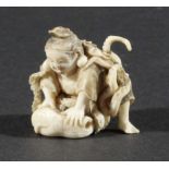 JAPANESE IVORY OKIMONO, of a man wrestling with an octopus, signature to base, width 3.5cm