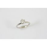 A DIAMOND SOLITAIRE RING BY TIFFANY & CO the brilliant-cut diamond weighs 0.83 carats and is set