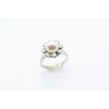 A DIAMOND AND CULTURED PEARL CLUSTER RING centred with a cultured pearl measuring approximately 8.