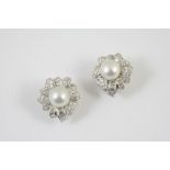 A PAIR OF DIAMOND AND CULTURED PEARL EARRINGS each earring set with a cultured pearl measuring