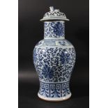 CHINESE BLUE AND WHITE BALUSTER VASE AND COVER, Kangxi style, painted with flowerheads amongst