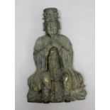 MING STYLE BRONZE FIGURE OF A DEITY, cast seated with his eyes shut and holding his hands, with