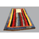 FARS GABBEH RUG, a 1970s thick or shag pile rug,of stripped design inside a blue border, Qashqa'i