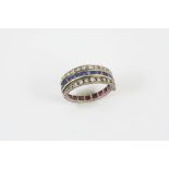 A SAPPHIRE, RUBY AND DIAMOND SWIVEL ETERNITY RING set with calibre-cut sapphires and rubies and