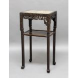 CHINESE HARDWOOD TABLE OR STAND, the marble top above pierced fretwork and a lower shelf, height