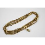 A VICTORIAN GOLD MUFF CHAIN formed alternately with fancy oval links and long links with openwork