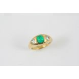AN EMERALD AND DIAMOND RING the rectangular cushion-shaped cabochon emerald weighs 1.46 carats and