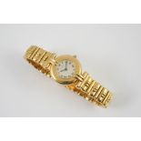 A LADY'S 18CT GOLD WRISTWATCH BY CARTIER the signed circular dial with Roman numerals, numbered