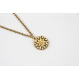 A VICTORIAN PEARL SET PENDANT of flowerhead form, centred with a small pearl and overall with half