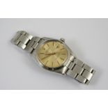 A GENTLEMAN'S STAINLESS STEEL OYSTER PERPETUAL DATE WRISTWATCH BY ROLEX the gold coloured dial