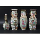 PAIR OF CHINESE CANTON STYLE VASES, enamelled with figural scenes beneath gilt chilong, height 25cm;