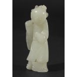 CHINESE WHITE JADE FIGURE OF A BOY, standing holding a lotus branch, height 7cm