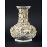 CHINESE WHITE LACQUER BOTTLE VASE, carved with birds amongst flowering foliage on a hexagonal