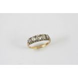 A DIAMOND FIVE STONE RING set with five graduated old cushion-shaped diamonds, in 18ct gold. Size