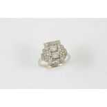 AN ART DECO DIAMOND RING the two old brilliant-cut diamonds are set within a surround of rose-cut