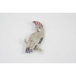 A DIAMOND, RUBY AND SAPPHIRE COCKATOO BROOCH set overall with circular-cut diamonds and calibre-