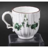 BRISTOL COFFEE CUP, circa 1770-80, of reeded form, green painted with floral swags beneath a brown
