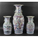 GARNITURE OF CHINESE FAMILLE ROSE VASES, with figural panels surrounded by scrolling foliage with