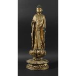 CARVED, LACQUERED AND GILT WOOD AMIDA NYORAI, probably Edo period Japanese, standing in pleated