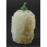 CHINESE PALE CELADON AND RUSSET JADE SNUFF BOTTLE, late 18th or 19th century, of fruit form,
