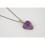 AN AMETHYST AND PEARL HEART-SHAPED PENDANT the heart-shaped amethyst is set with three graduated