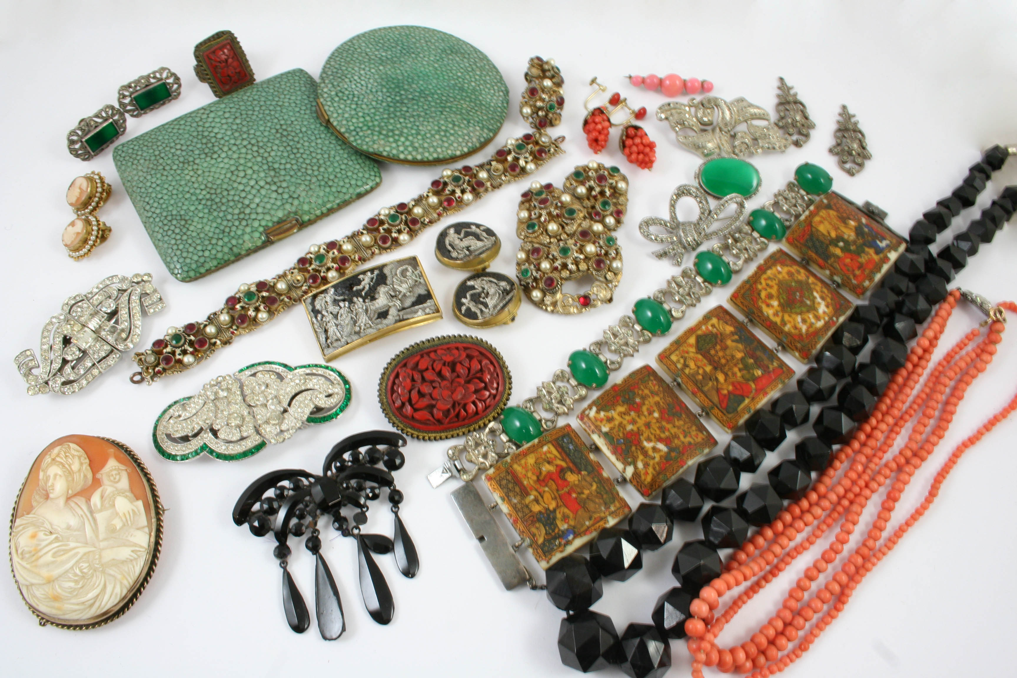 A QUANTITY OF JEWELLERY including two coral necklaces, various paste set brooches, a pair of coral