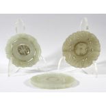 THREE CHINESE CELADON JADE BI DISCS, with articulated centre panels, with floral carved