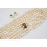 A TWO ROW UNIFORM CULTURED PEARL NECKLACE the pearls measure approximately 6.4mm and are set to an