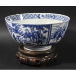 CHINESE BLUE AND WHITE BOWL, Kangxi style but later, painted with four figural scenes, the